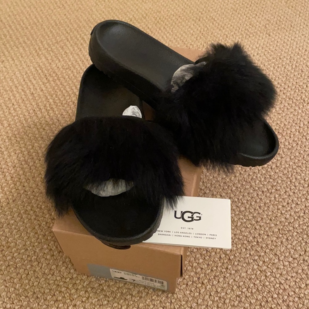 Brand new, in box, furry Treadlite slippers.